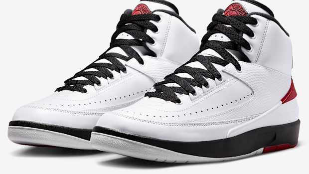 View of white, black, and red Jordan shoes.
